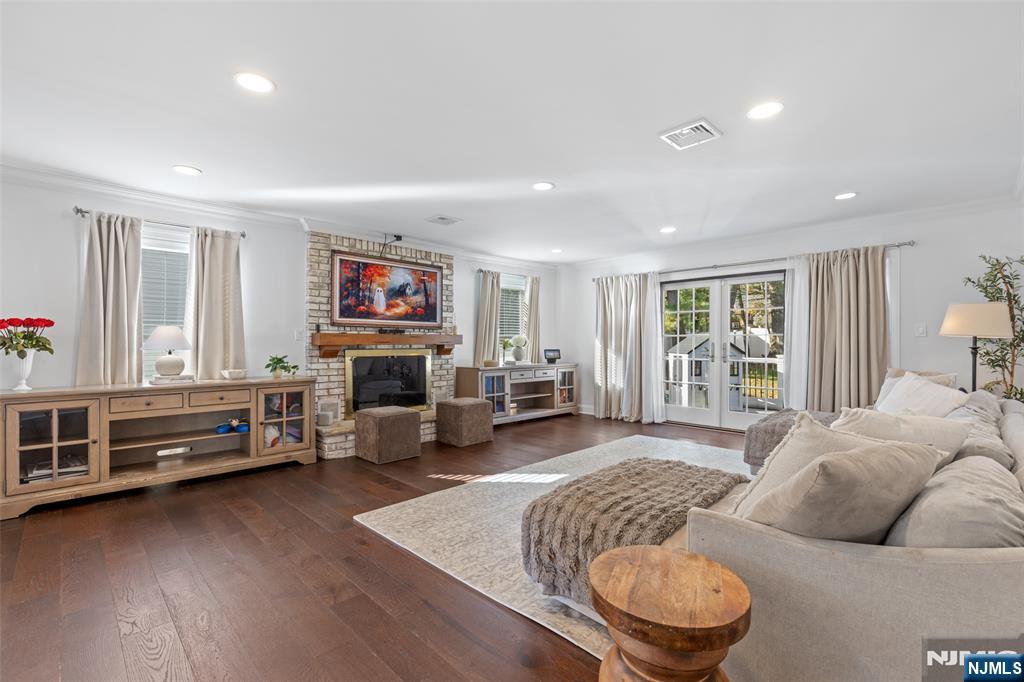 11 Robin Hood Way Wayne, NJ 07470 - Photo 9 of 36 a living room with furniture and a fireplace