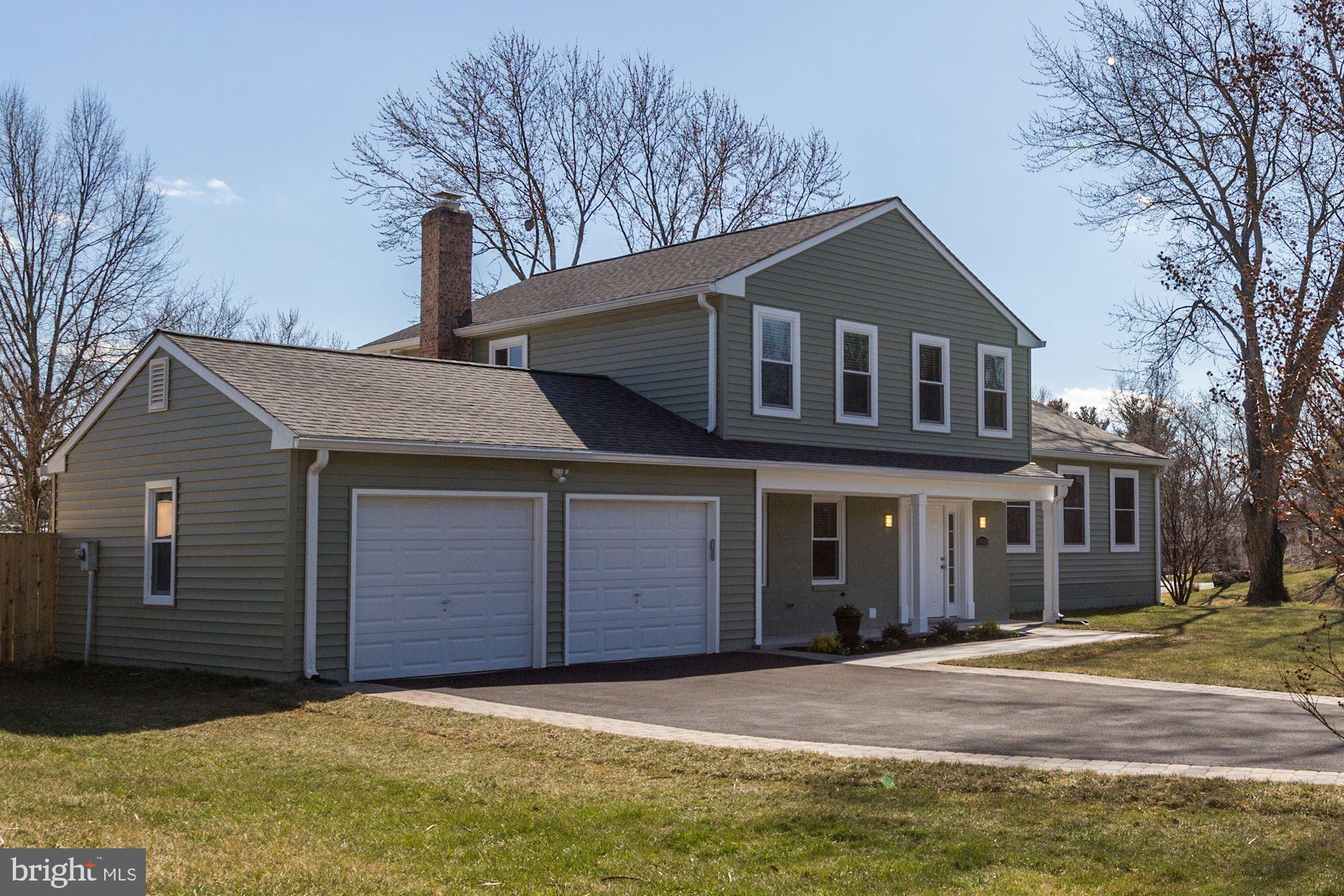 19608 Mosby Way Poolesville, MD 20837 - Photo 3 of 47 a front view of a house with a yard and garage