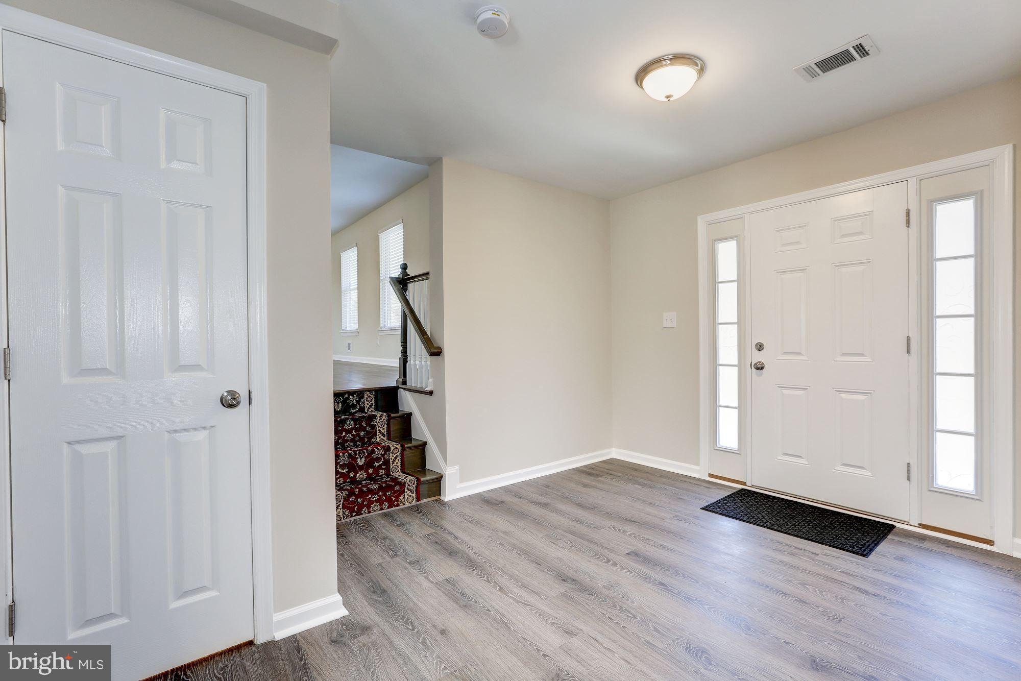 19608 Mosby Way Poolesville, MD 20837 - Photo 10 of 47 an empty room with wooden floor and closet