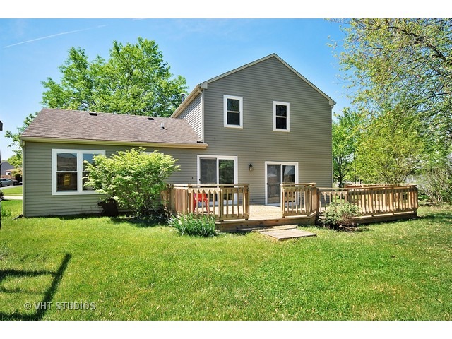 965 Chelsea Lane Aurora, IL 60504 - Photo 2 of 2 a front view of a house with a yard