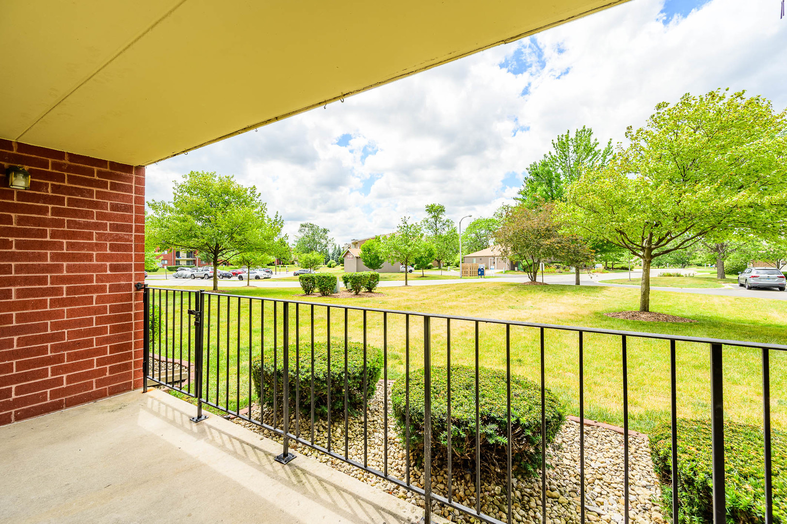 18136 Rita Road, Unit 1D Tinley Park, IL 60477 - Photo 11 of 11 a view of green field with iron fence