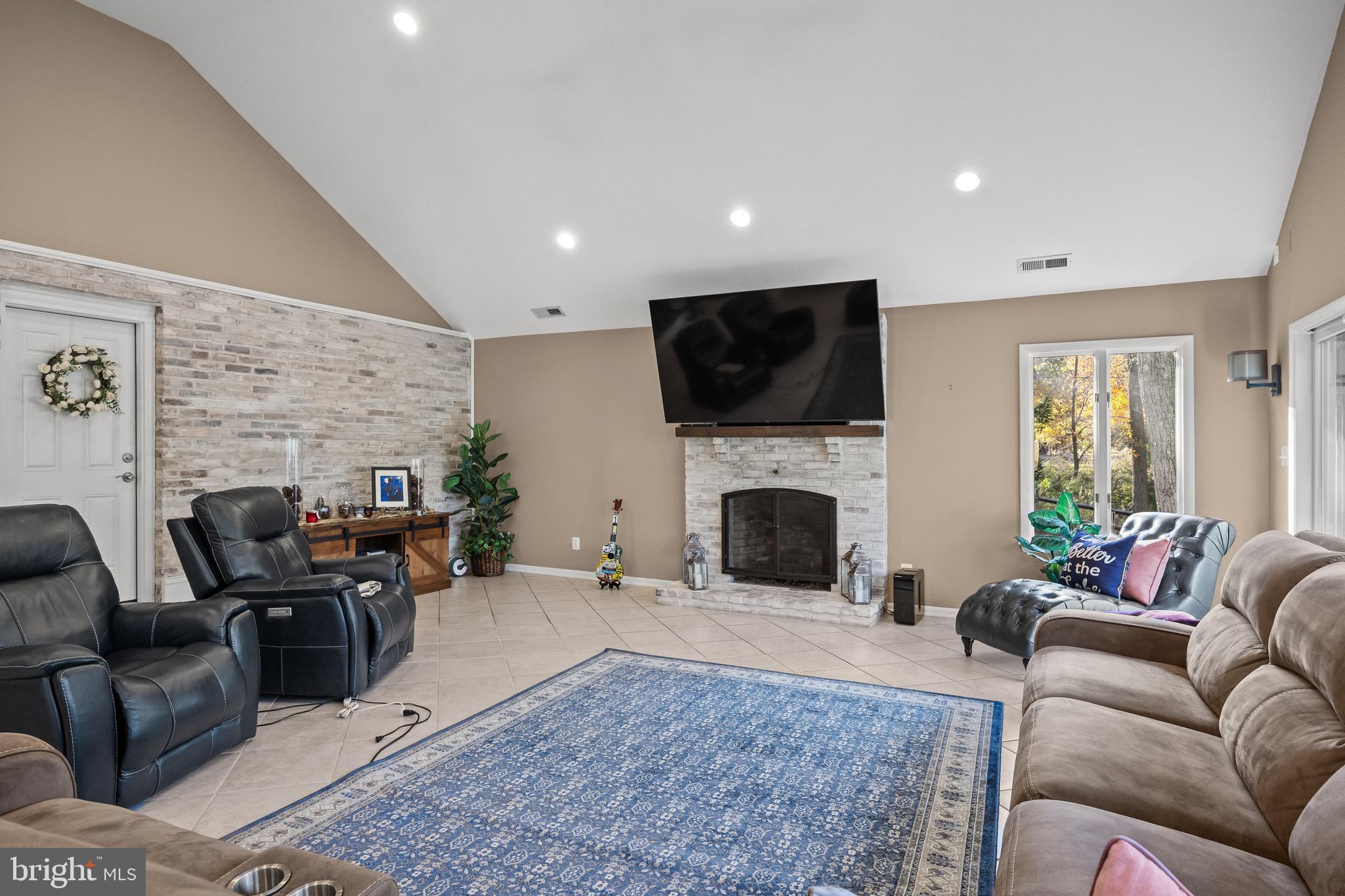155 Tuckerton Road Medford Lakes, NJ 08055 - Photo 15 of 48 a living room with furniture a fireplace and a flat screen tv