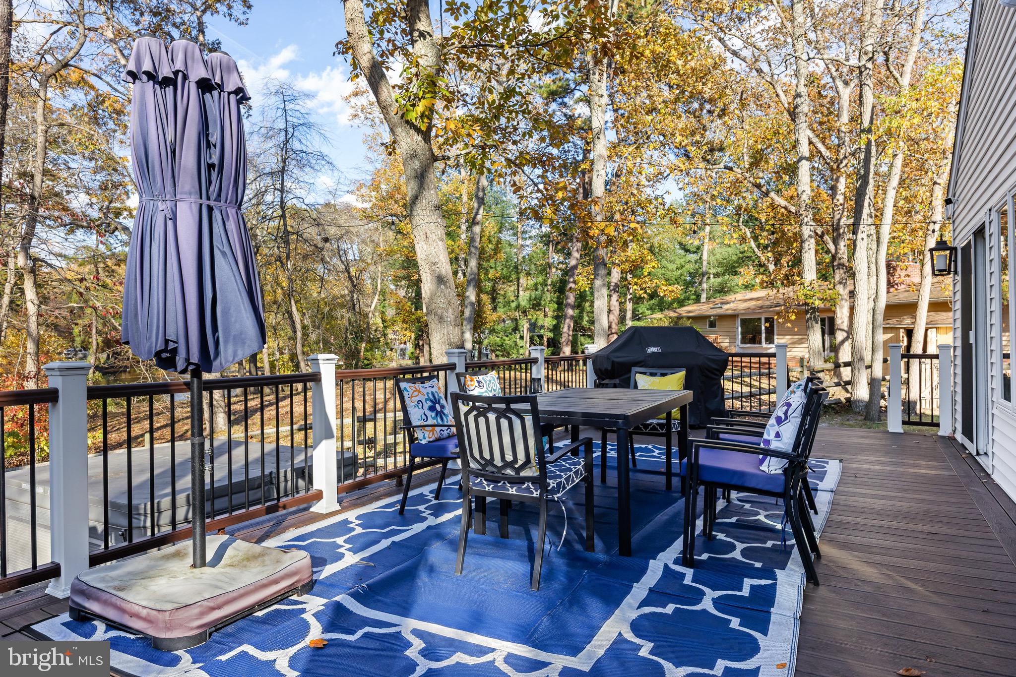155 Tuckerton Road Medford Lakes, NJ 08055 - Photo 28 of 48 a view of a patio with a table and chairs