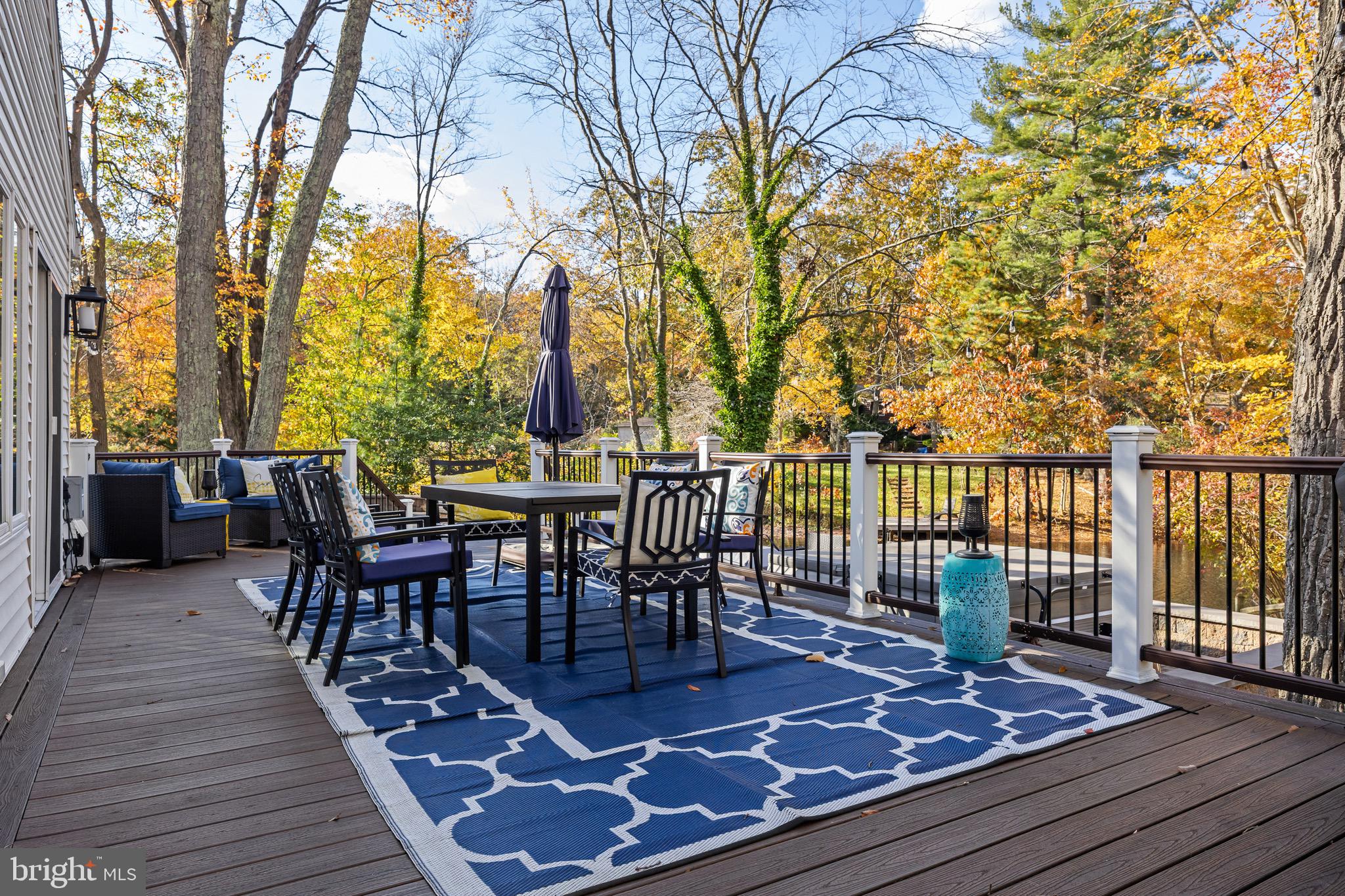 155 Tuckerton Road Medford Lakes, NJ 08055 - Photo 29 of 48 a view of a roof deck with table and chairs and wooden floor