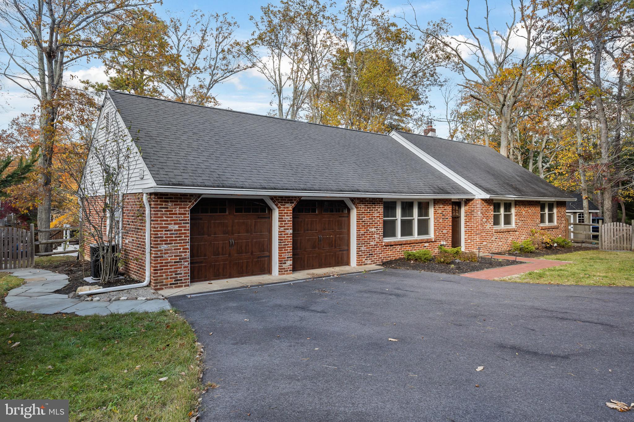 155 Tuckerton Road Medford Lakes, NJ 08055 - Photo 4 of 48 a front view of a house with a yard and garage
