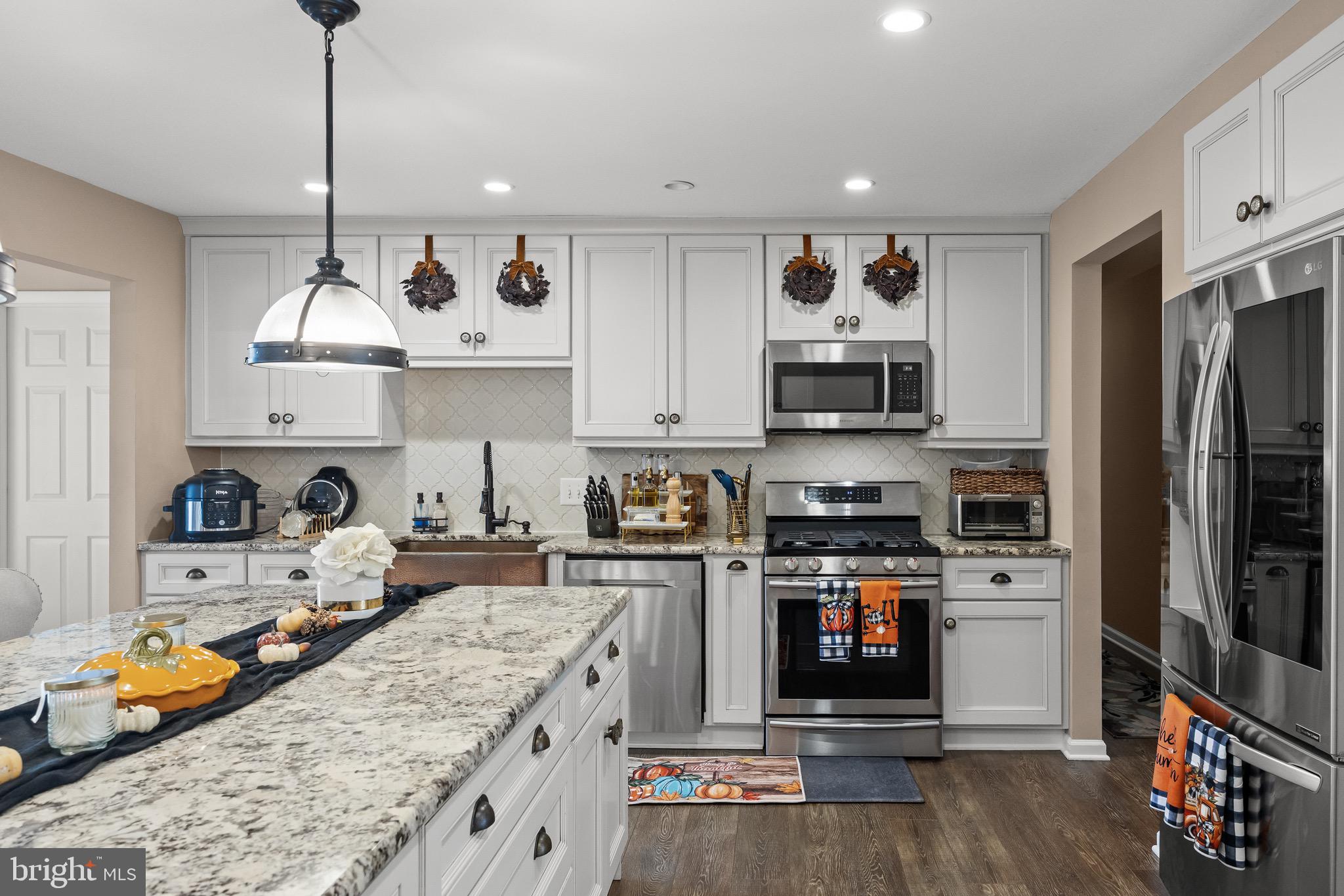 155 Tuckerton Road Medford Lakes, NJ 08055 - Photo 9 of 48 a kitchen with stainless steel appliances granite countertop a stove and cabinets