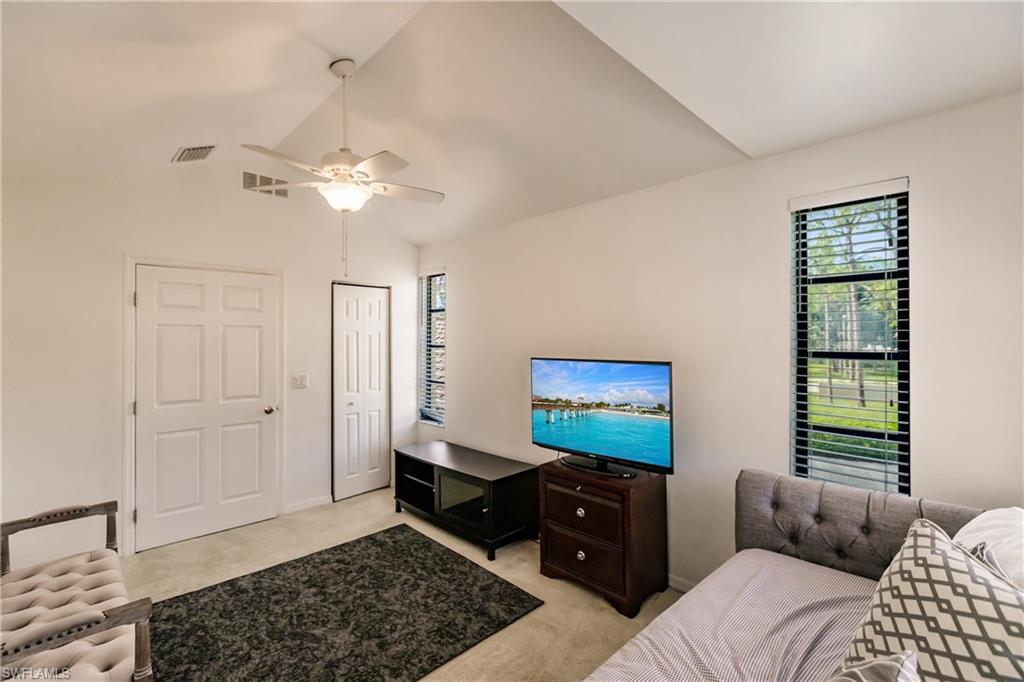 Undisclosed Address Naples, FL 34113 - Photo 15 of 24 a bedroom with a bed and a window