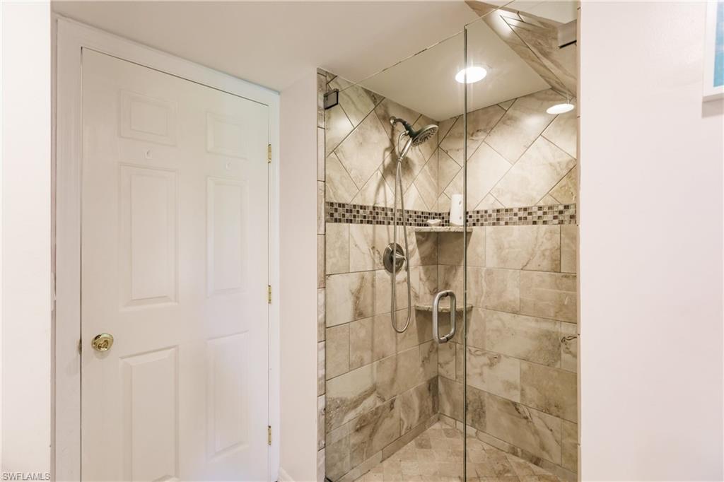 Undisclosed Address Naples, FL 34113 - Photo 18 of 24 a bathroom with a shower