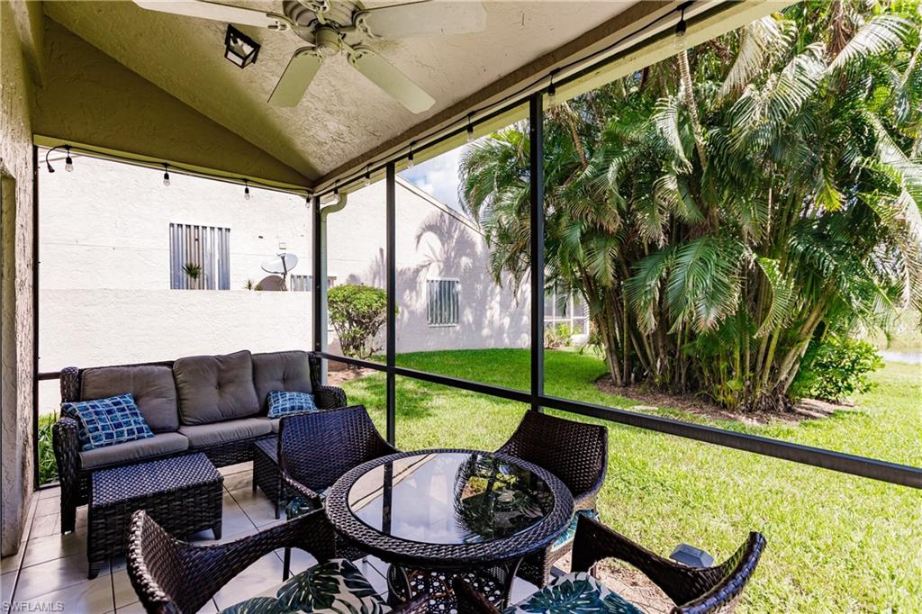 Undisclosed Address Naples, FL 34113 - Photo 21 of 24 a view of a chairs and table in patio with a backyard