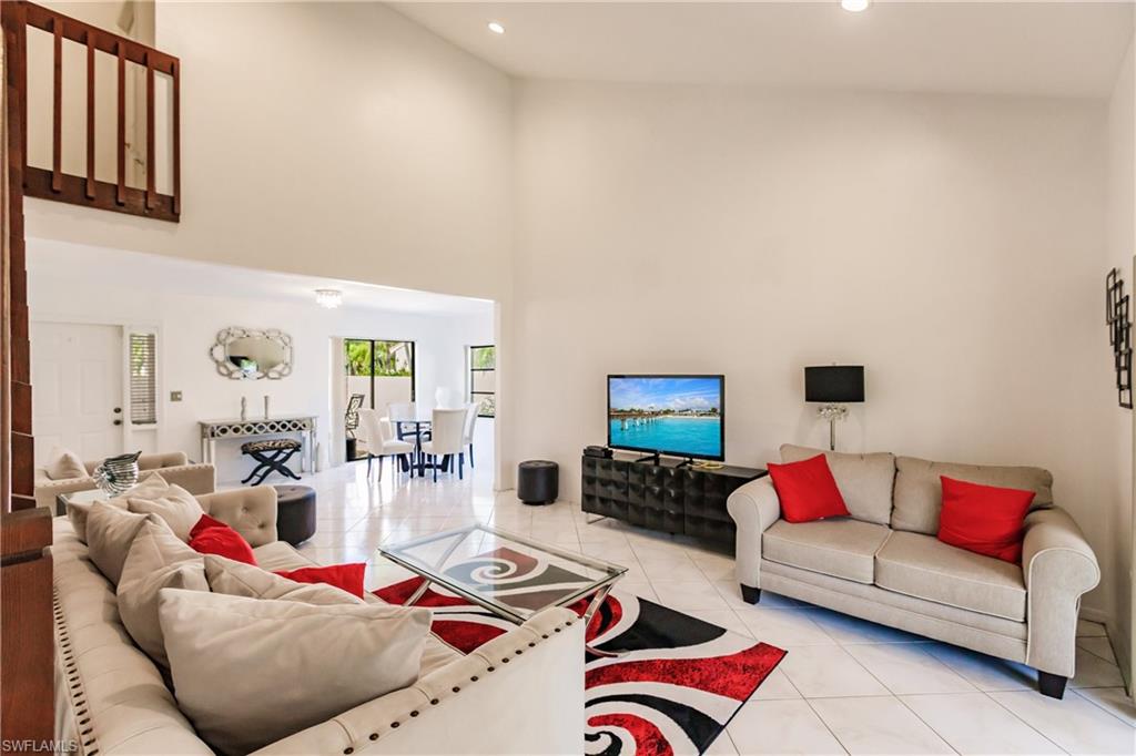 Undisclosed Address Naples, FL 34113 - Photo 4 of 24 a living room with furniture and a couch