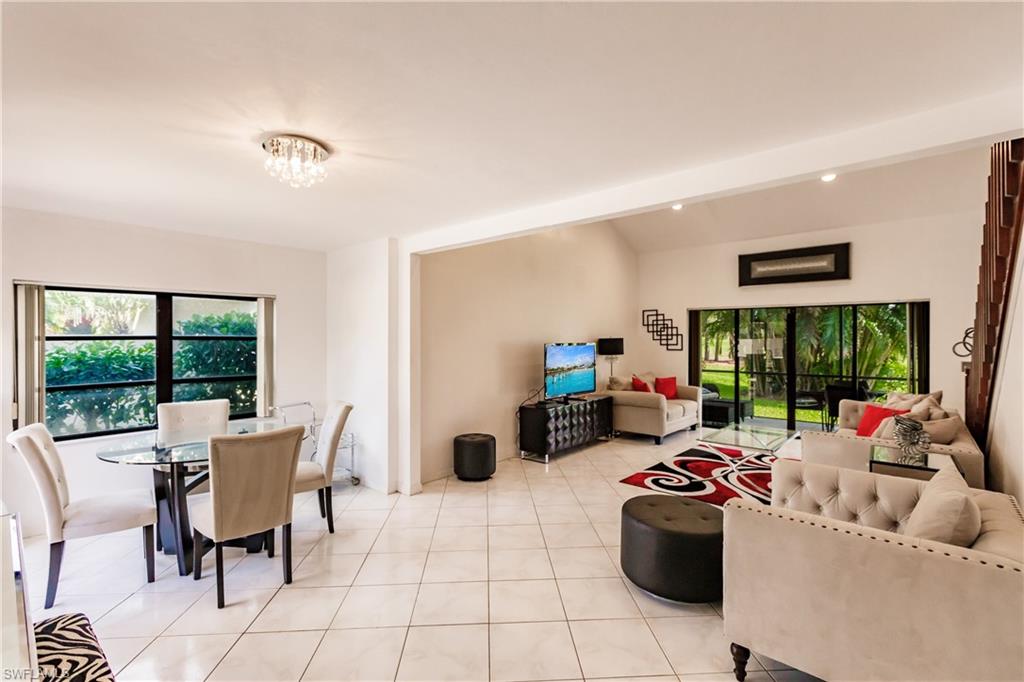 Undisclosed Address Naples, FL 34113 - Photo 6 of 24 a living room with furniture and a large window