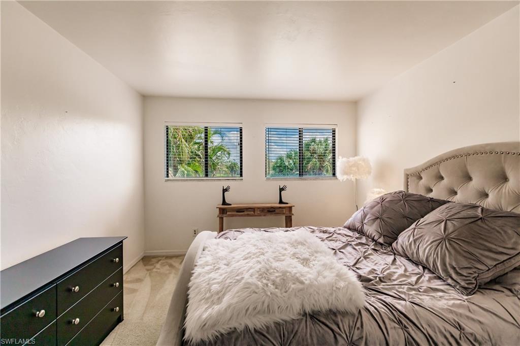 Undisclosed Address Naples, FL 34113 - Photo 10 of 24 a bedroom with a bed and a window