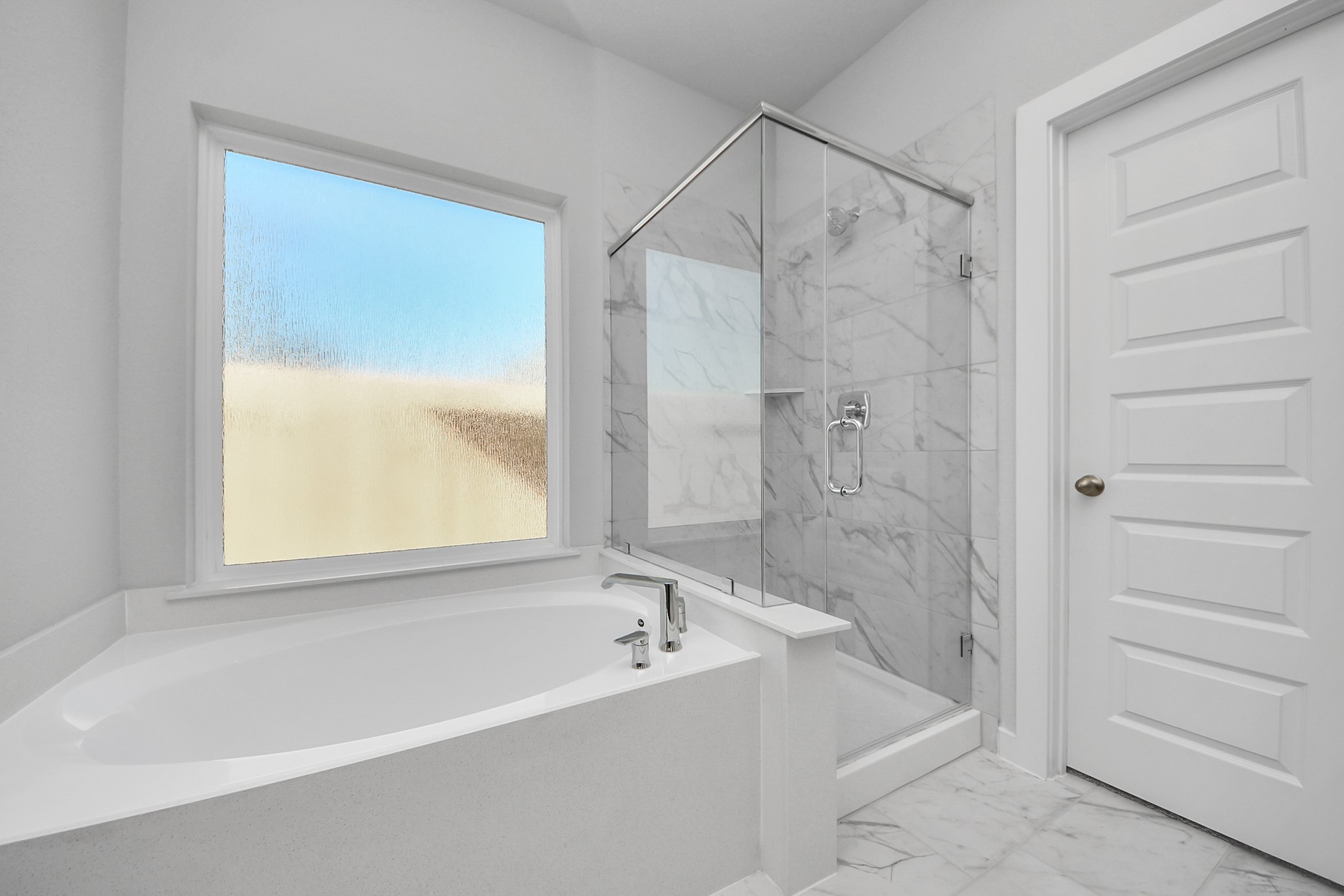 3002 Bury Park Dr Spring Spring, TX 77373 - Photo 28 of 45 Indulge in a spa-like retreat within the confines of this primary bathroom. Delight in a spacious walk-in shower enveloped in stylish tile surround, unwind in a separate garden tub adorned with custom detailing.