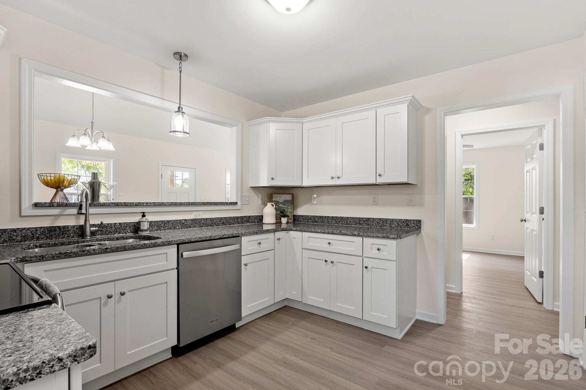 805 Hunter Street York, SC 29745 - Photo 12 of 38 a kitchen with a sink stove and cabinets