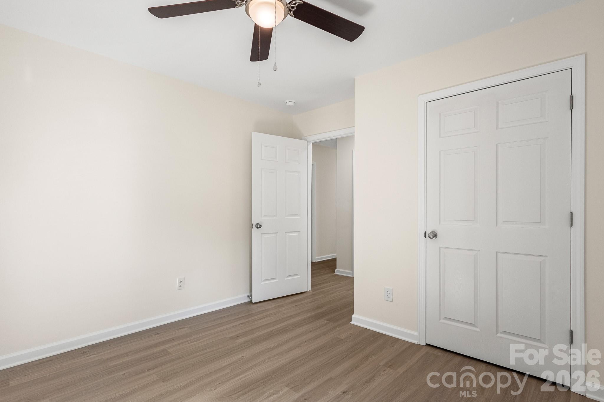 805 Hunter Street York, SC 29745 - Photo 20 of 38 a view of an empty room with wooden floor