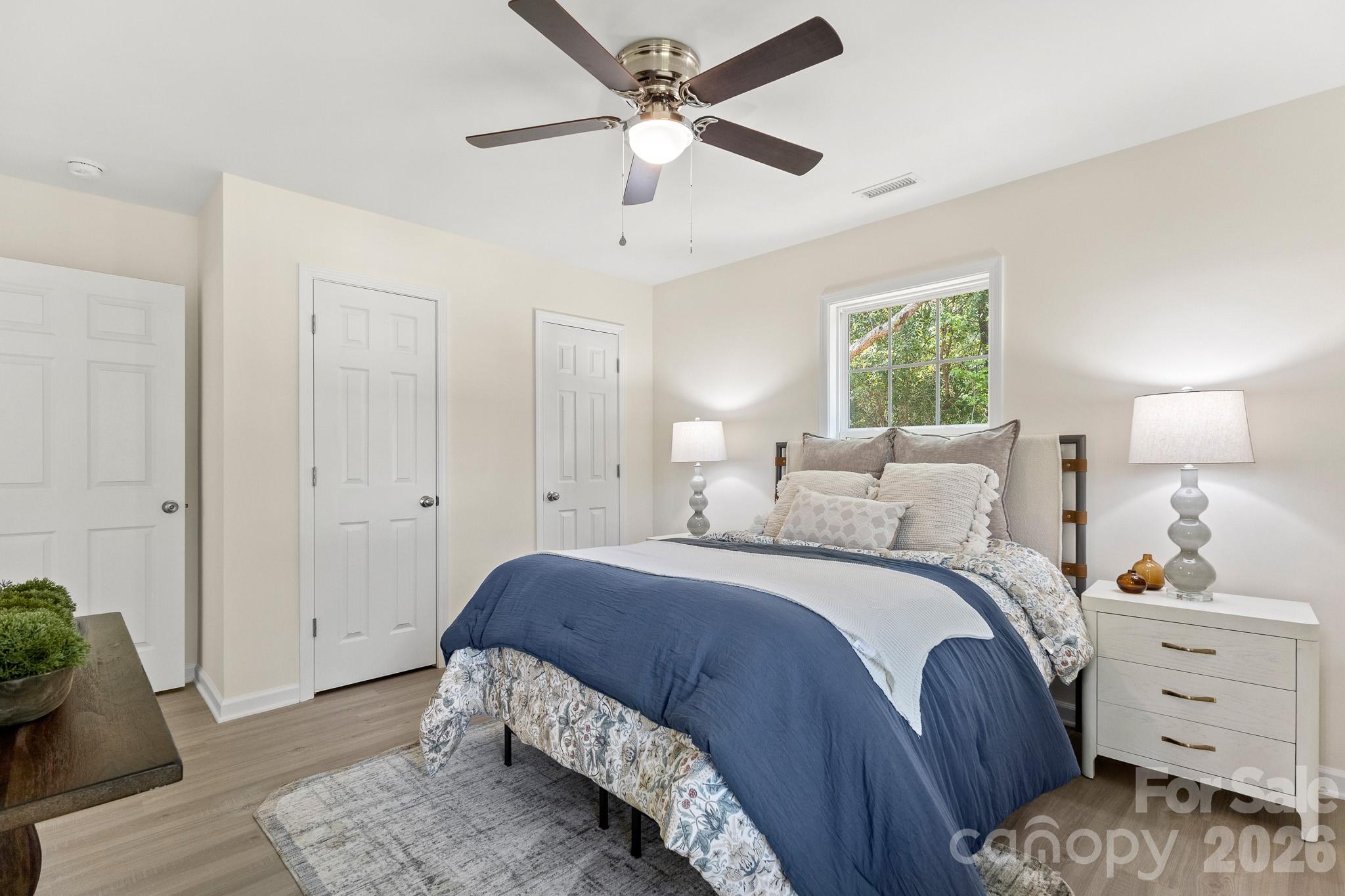 805 Hunter Street York, SC 29745 - Photo 22 of 38 a bedroom with a bed and a window