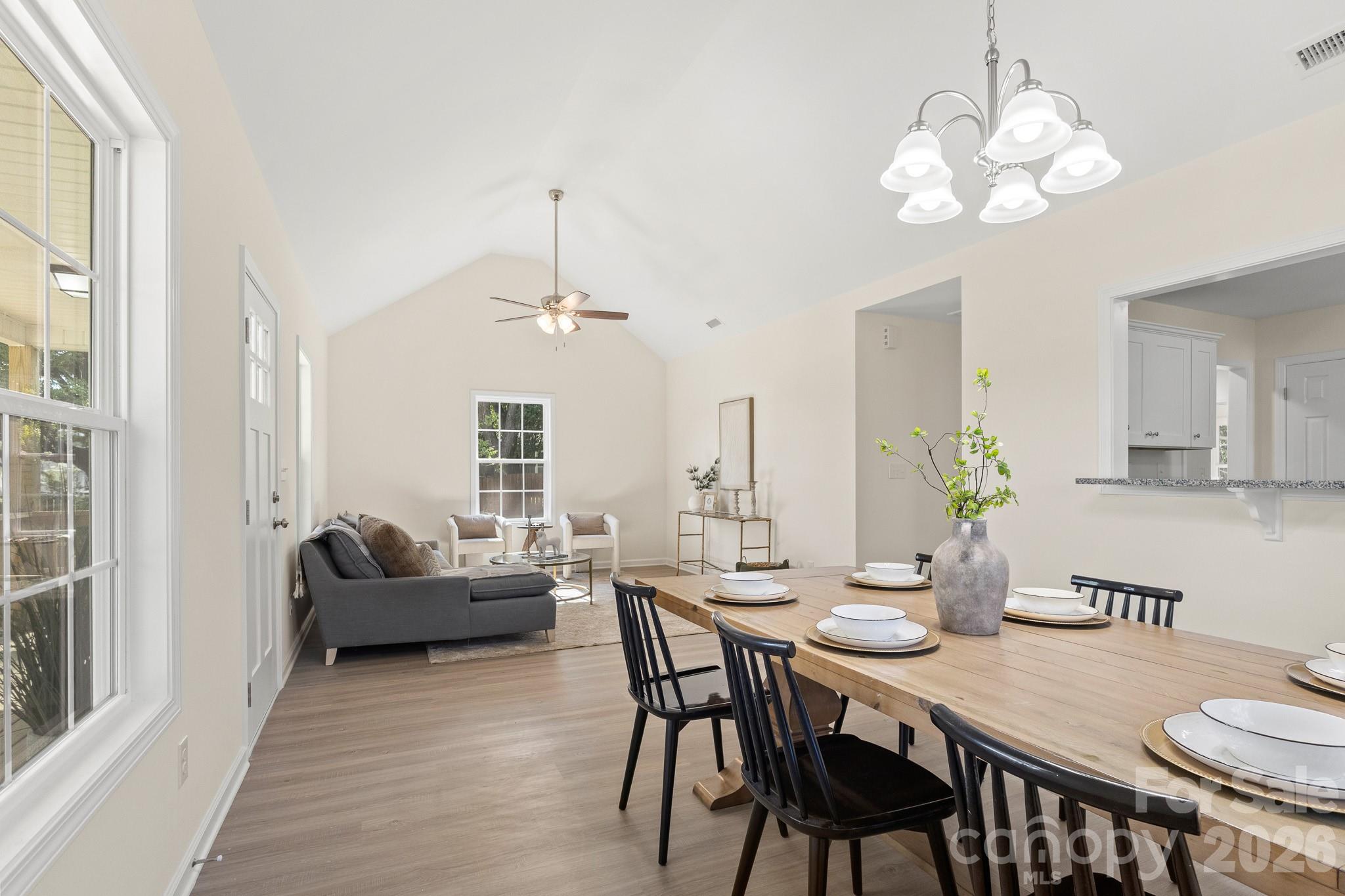 805 Hunter Street York, SC 29745 - Photo 9 of 38 a view of a dining room with furniture wooden floor and chandelier