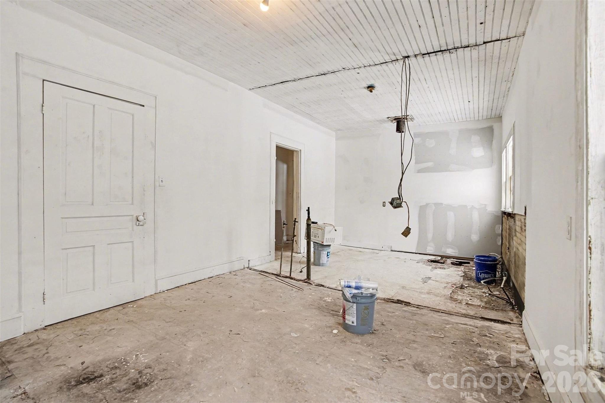 540 South Halifax Street Mount Pleasant, NC 28124 - Photo 11 of 34 an empty room with a bench and painted walls