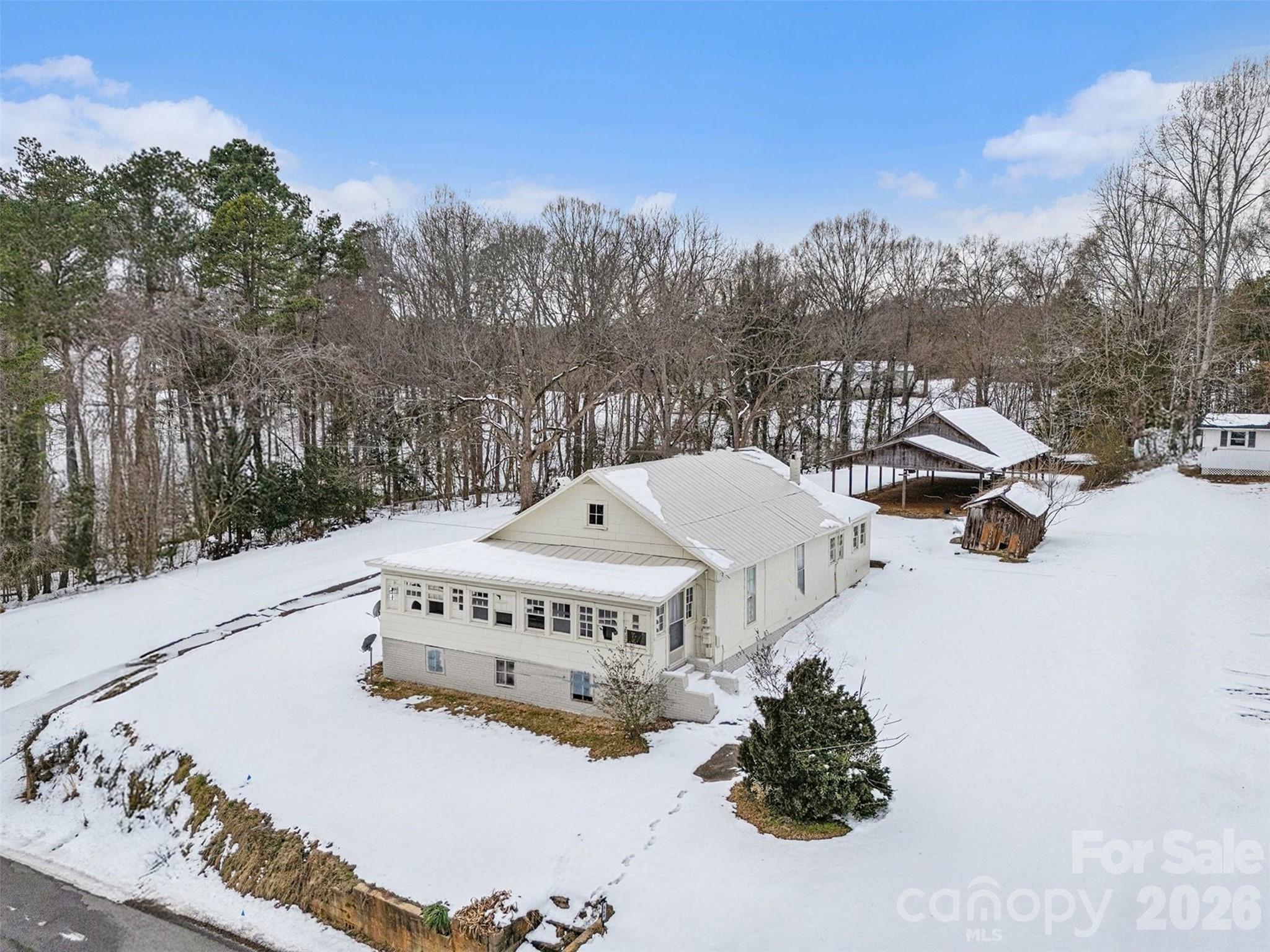540 South Halifax Street Mount Pleasant, NC 28124 - Photo 2 of 34 a roof view covered with snow in front of house