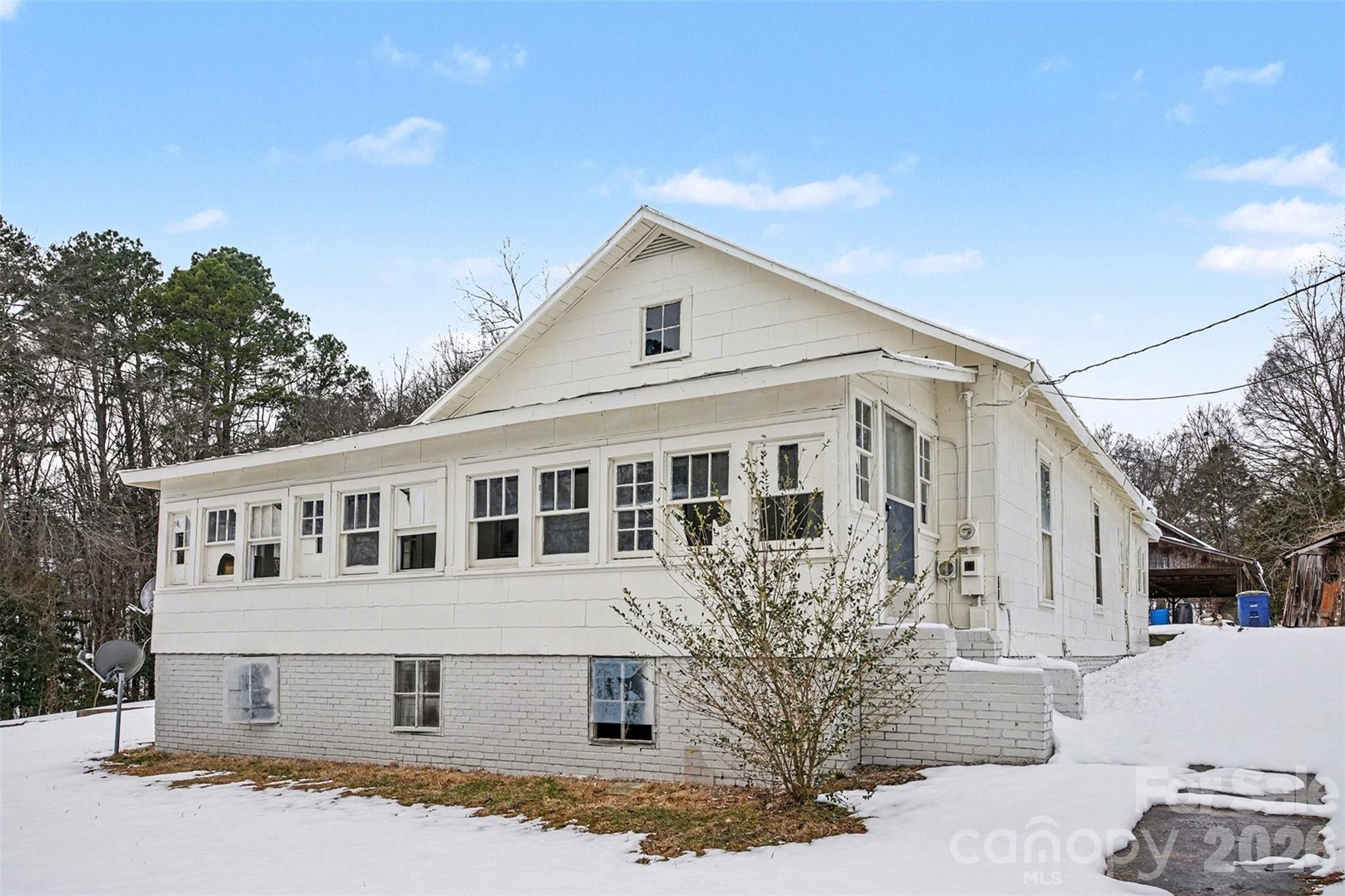 540 South Halifax Street Mount Pleasant, NC 28124 - Photo 4 of 34 a view of a white house with a large windows