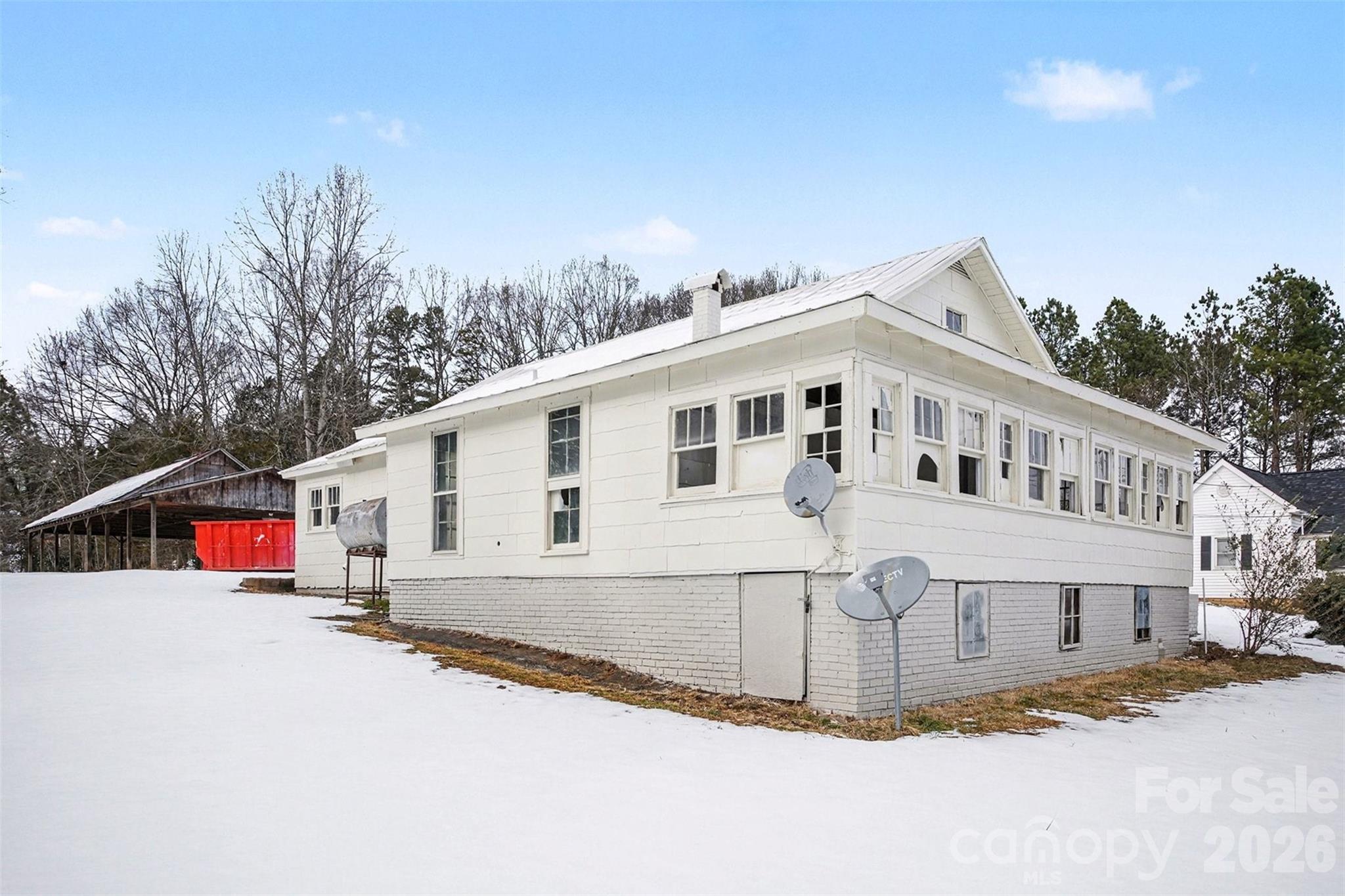 540 South Halifax Street Mount Pleasant, NC 28124 - Photo 6 of 34 a view of a white house with a road