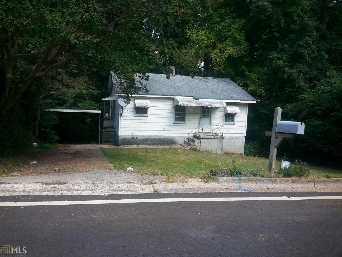 4610 Burks Road Forest Park, GA 30297 - Photo 1 of 1 a front view of a house with a yard and garage