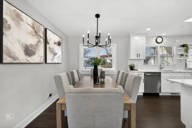 a dining room with furniture and wooden floor
