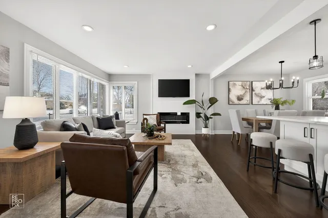 a living room with fireplace furniture and a flat screen tv