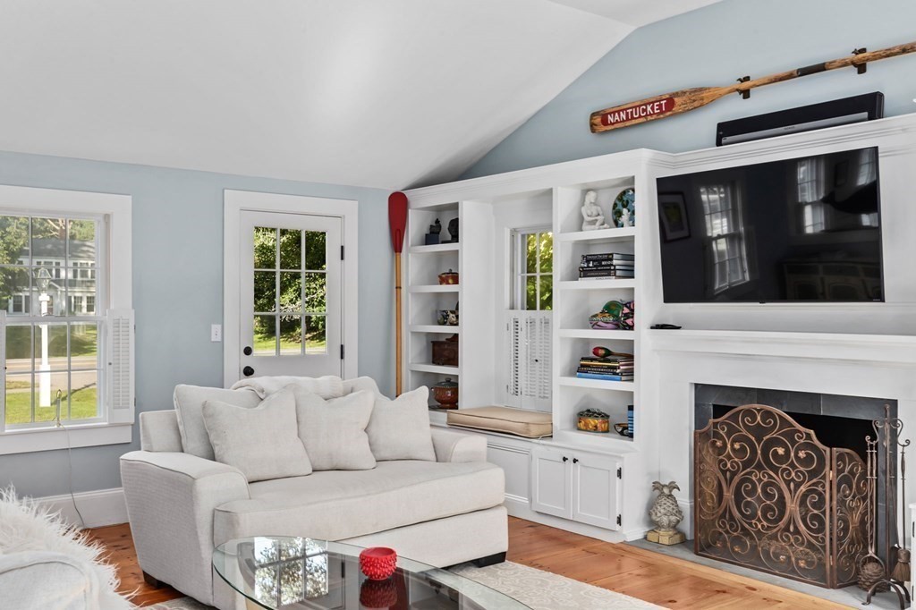 982 Main Street Hingham, MA 02043 - Photo 11 of 41 a living room with furniture a window and a fireplace