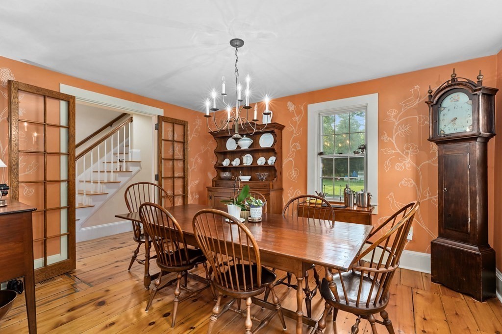 982 Main Street Hingham, MA 02043 - Photo 15 of 41 a dining room with furniture a chandelier and wooden floor