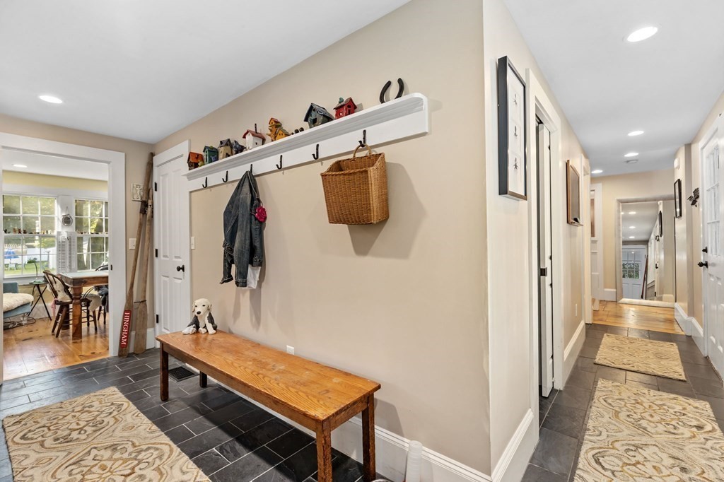 982 Main Street Hingham, MA 02043 - Photo 22 of 41 a hallway with a table and a couch