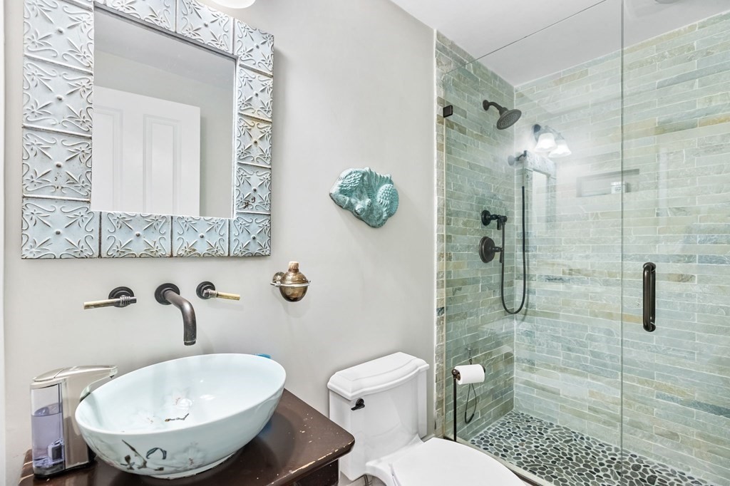 982 Main Street Hingham, MA 02043 - Photo 24 of 41 a bathroom with a toilet sink and shower