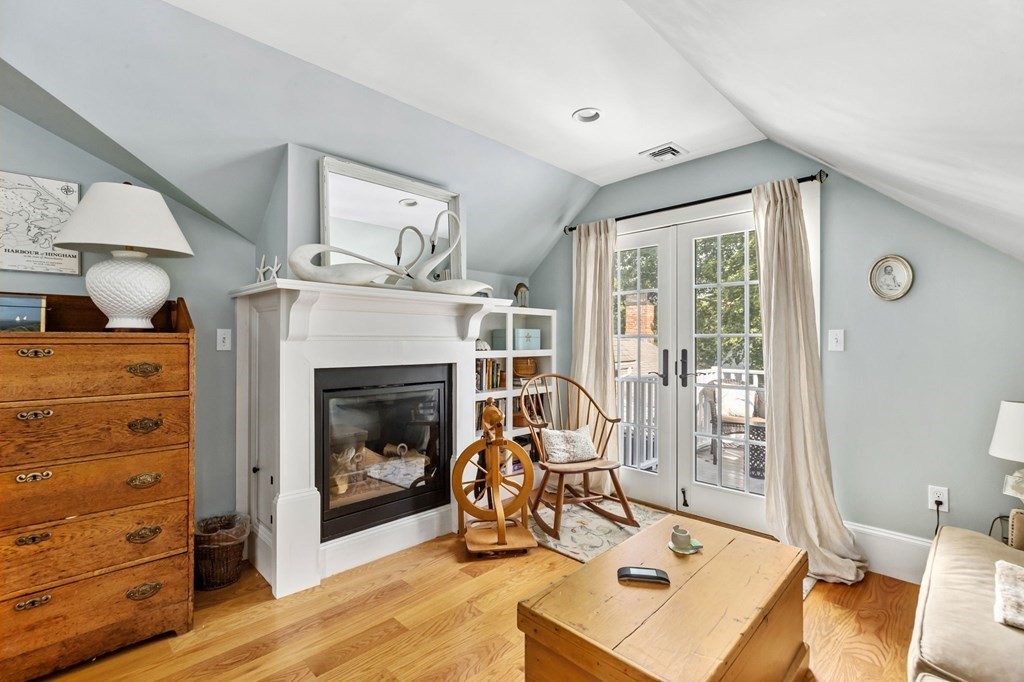 982 Main Street Hingham, MA 02043 - Photo 27 of 41 a living room with furniture and a fireplace