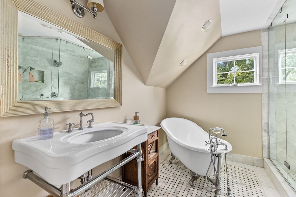 982 Main Street Hingham, MA 02043 - Photo 29 of 41 a bathroom with a sink a toilet a mirror and a window