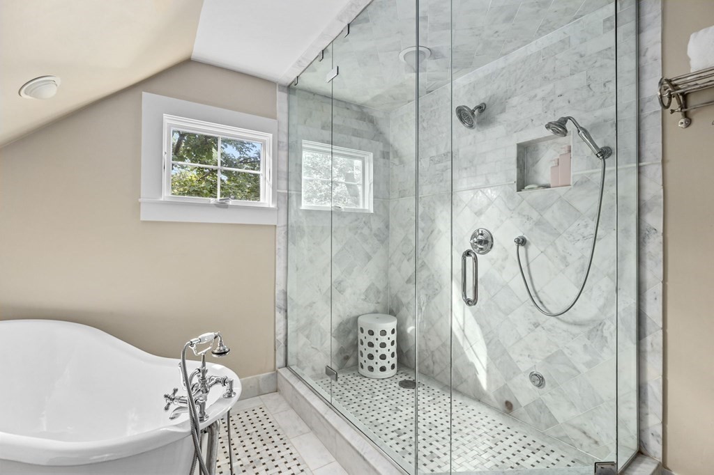 982 Main Street Hingham, MA 02043 - Photo 30 of 41 a bathroom with a glass shower door