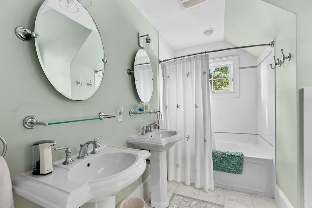 982 Main Street Hingham, MA 02043 - Photo 31 of 41 a bathroom with a sink and a mirror