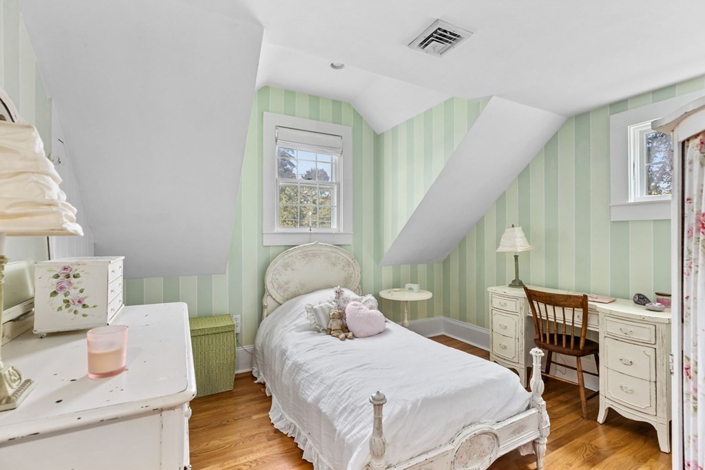 982 Main Street Hingham, MA 02043 - Photo 32 of 41 a bedroom with a bed and wooden floor