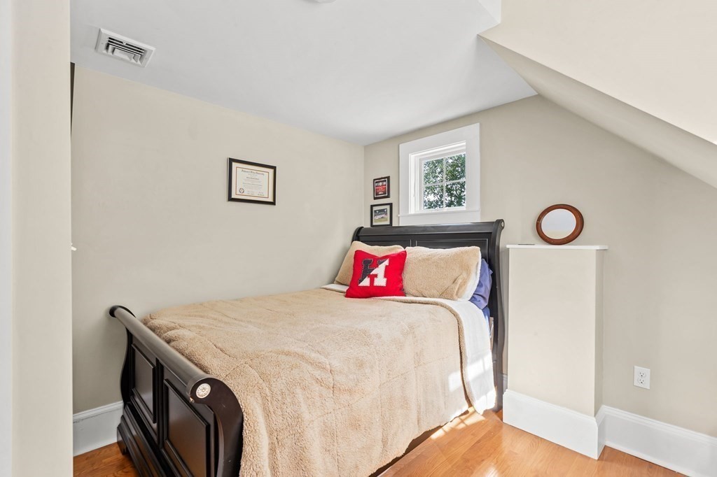 982 Main Street Hingham, MA 02043 - Photo 33 of 41 a bedroom with a bed and a table