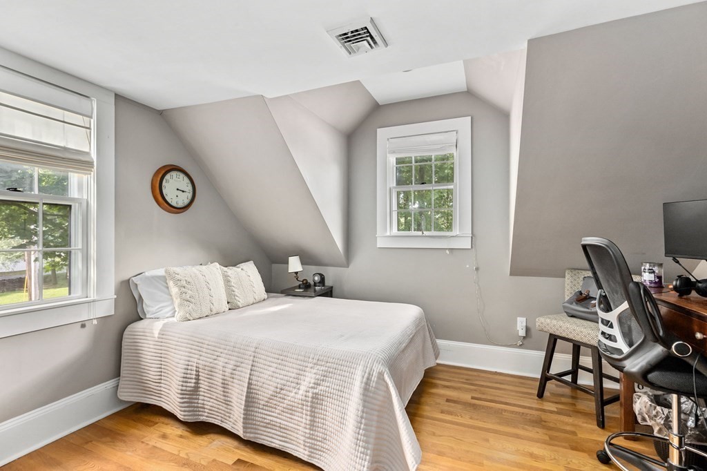 982 Main Street Hingham, MA 02043 - Photo 34 of 41 a bedroom with a bed and a window