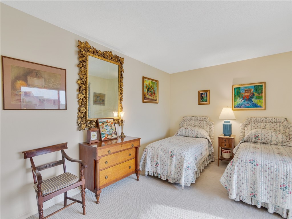 1880 Bay Road, Unit I319 Vero Beach, FL 32963 - Photo 18 of 36 a bedroom with two beds and a couch
