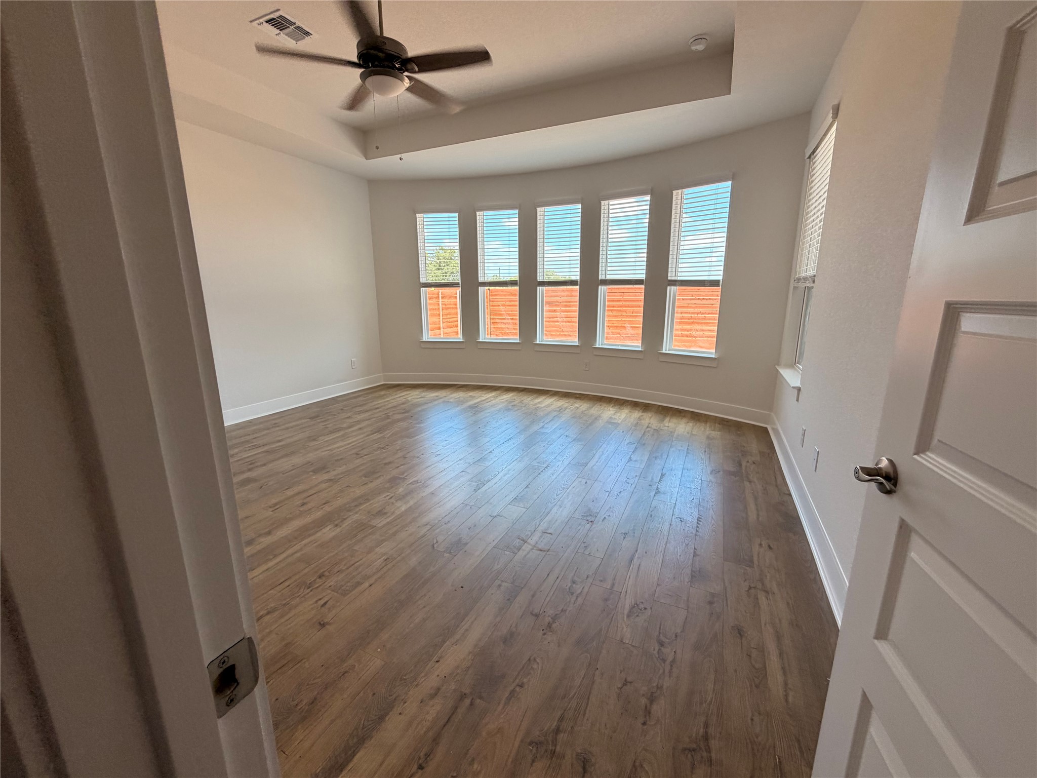2212 Tobiano Trace Georgetown, TX 78633 - Photo 6 of 33 Ample natural light illuminates this generously sized bedroom, creating a tranquil retreat.
