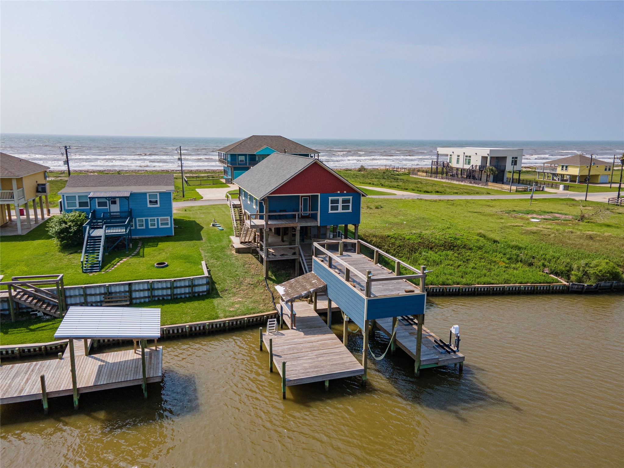 1453 County Road 230 Sargent, TX 77414 - Photo 1 of 30 swimming pool view with a seating space and a garden view