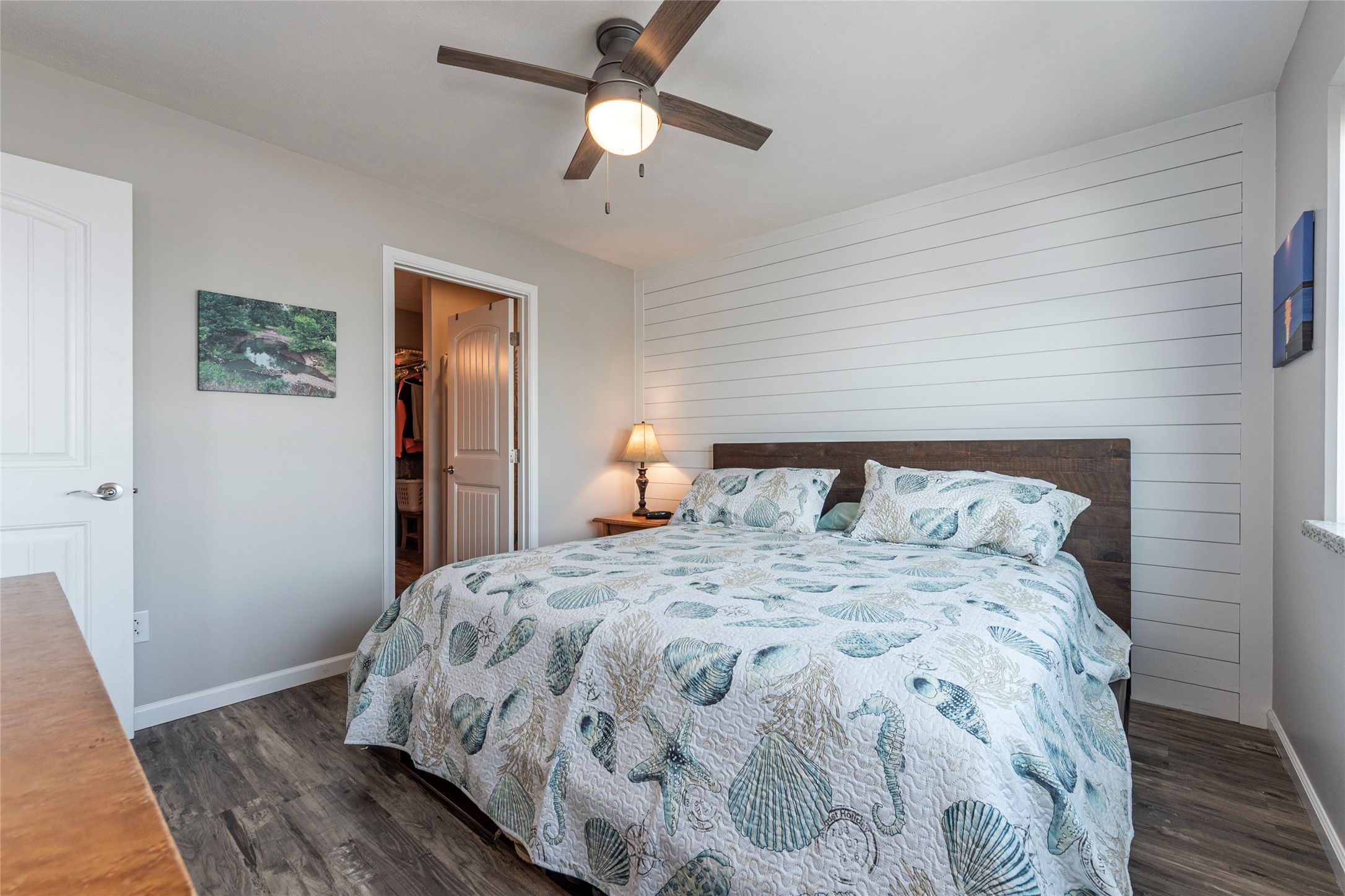 1453 County Road 230 Sargent, TX 77414 - Photo 13 of 30 a bedroom with a bed and wooden floor