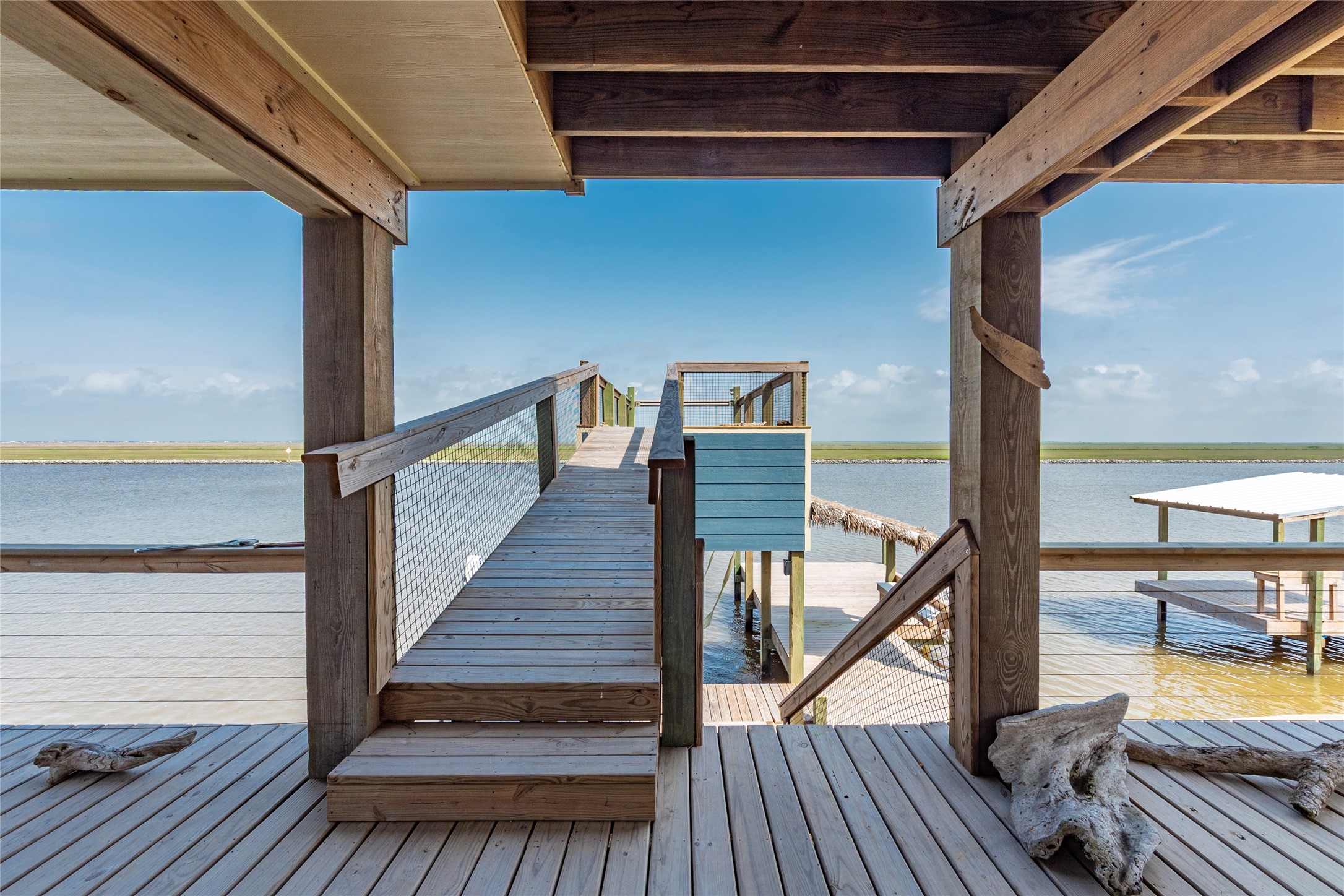 1453 County Road 230 Sargent, TX 77414 - Photo 19 of 30 a view of a balcony with chairs