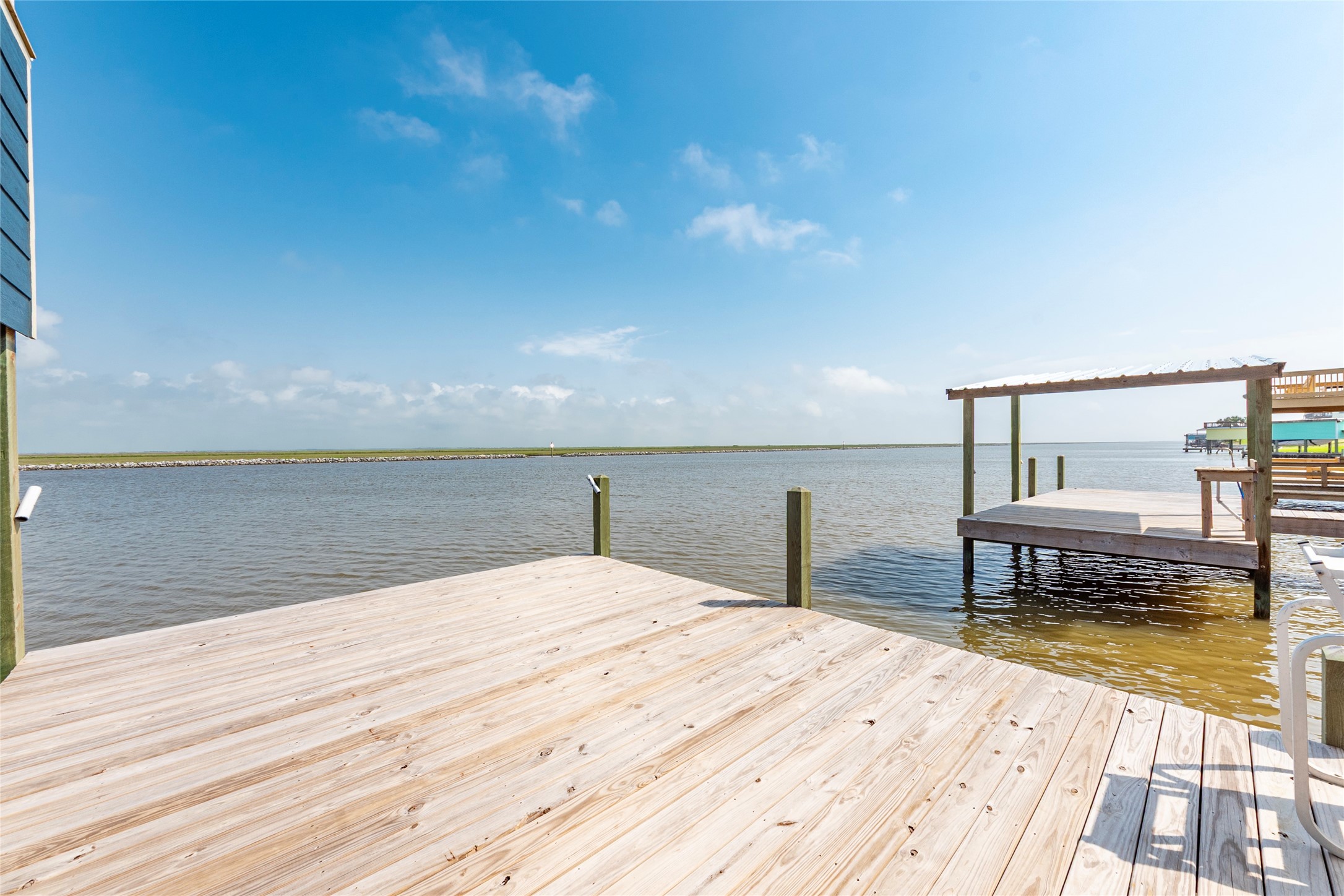 1453 County Road 230 Sargent, TX 77414 - Photo 25 of 30 a bedroom with a bed and table