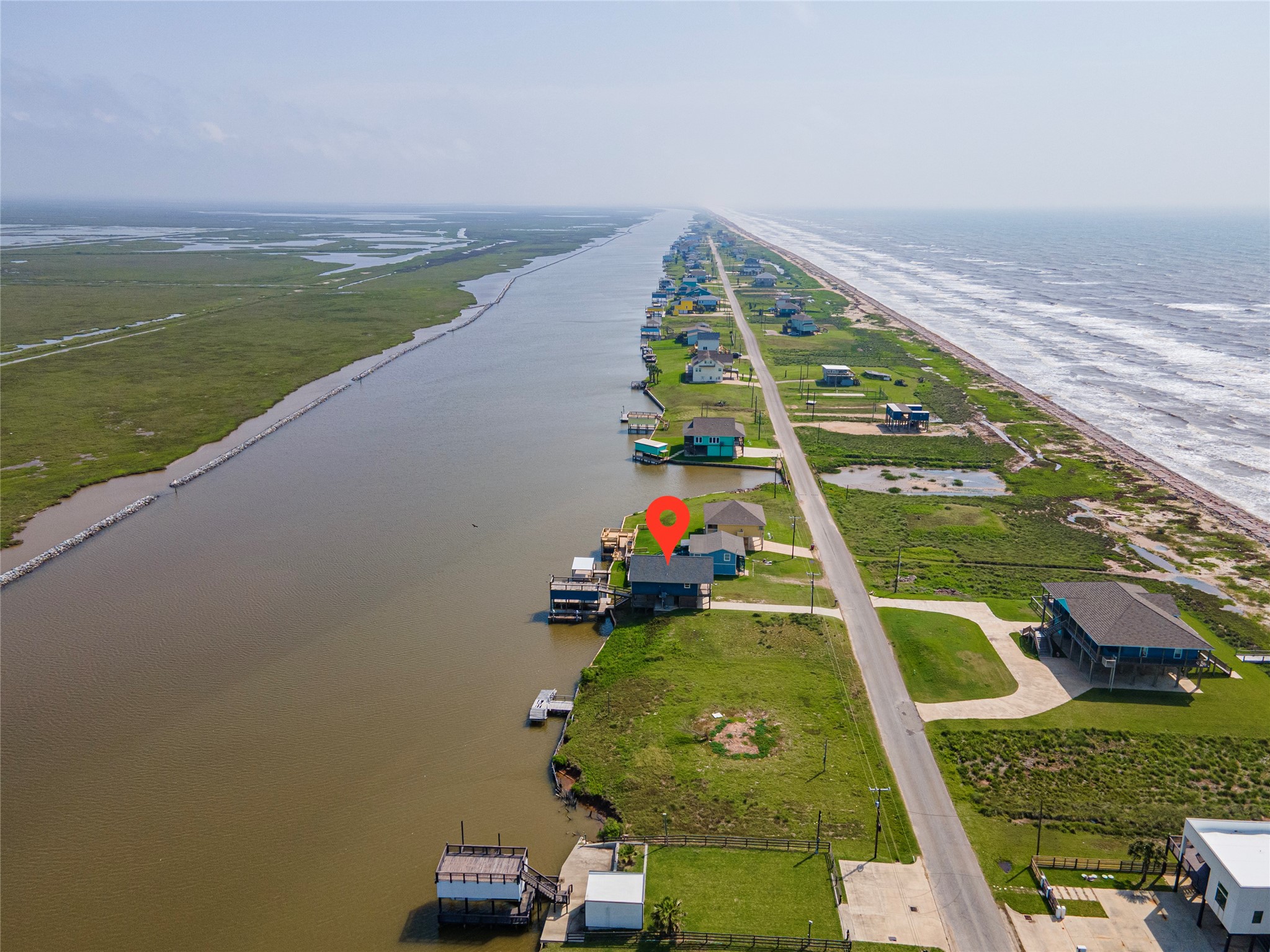 1453 County Road 230 Sargent, TX 77414 - Photo 27 of 30 swimming pool view with a floor to ceiling window and a yard