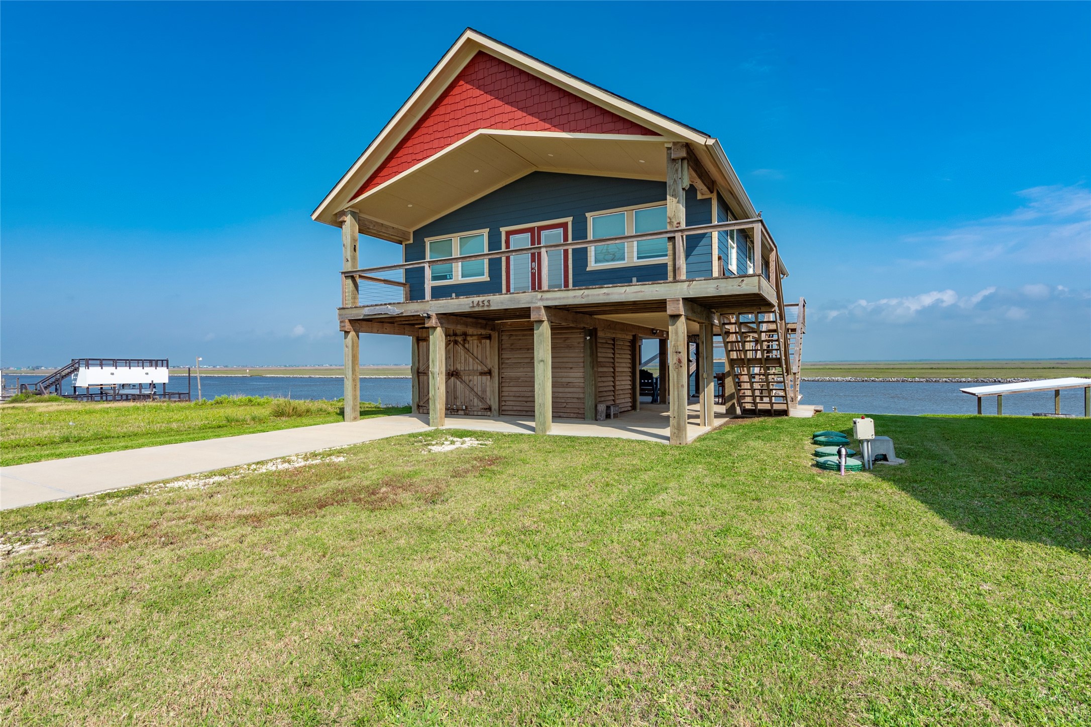 1453 County Road 230 Sargent, TX 77414 - Photo 3 of 30 a view of a house with a yard and sitting area