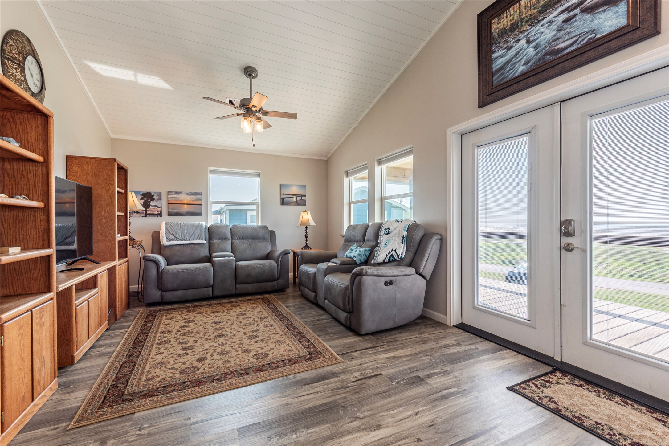 1453 County Road 230 Sargent, TX 77414 - Photo 4 of 30 a living room with furniture a flat screen tv and a rug
