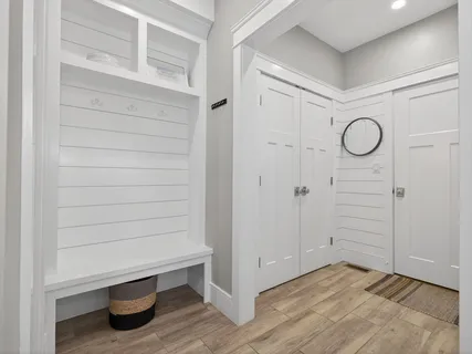 a view of a room with wooden floor