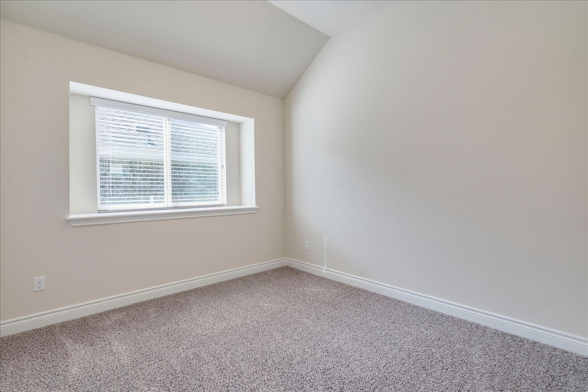 124 Compass Lane Kyle, TX 78640 - Photo 22 of 38 an empty room with a window